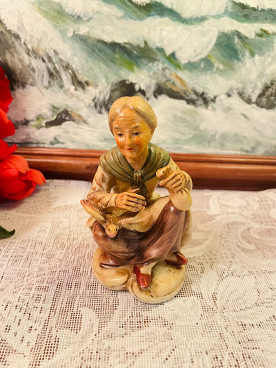 Vintage Seated Woman with Duck Figurine