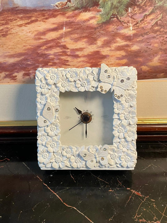 white floral butterfly clock, vintage decorative table clock, shabby chic butterfly clock, resin flower design clock, elegant mantel clock, gift idea home décor, romantic cottage style décor, floral clock with rhinestones, vintage aesthetic clock, butterfly theme home accessories