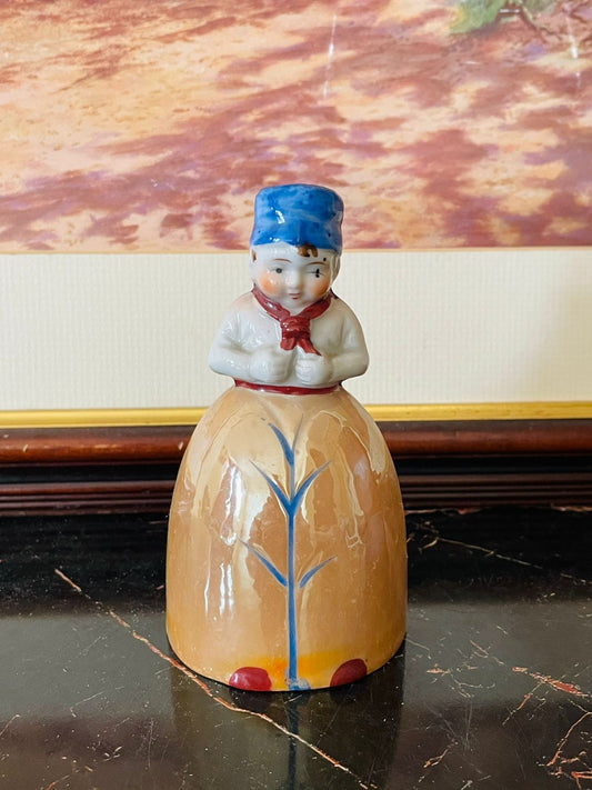 vintage porcelain bell, hand-painted ceramic bell, collectible porcelain figurine, boy figurine bell, antique porcelain décor, English porcelain collectible, rare thrift finds, heritage European treasures, vintage kitchen décor, porcelain bell England
