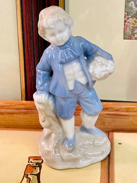 blue and white figurine, porcelain style figurine, vintage boy ornament, ceramic collectible, classic home decor, farmhouse shelf decor, european style figurine, glaze ceramic statue, cottagecore decor boy, vintage home accents