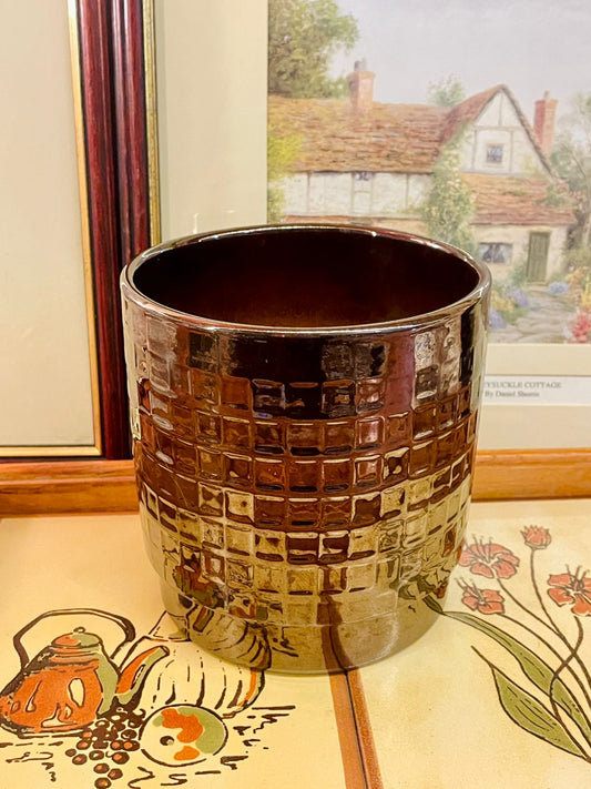 metallic planter, bronze planter, ceramic pot, textured planter, modern home decor, indoor plant pot, geometric pot, brown ceramic planter, reflective planter, stylish plant pot