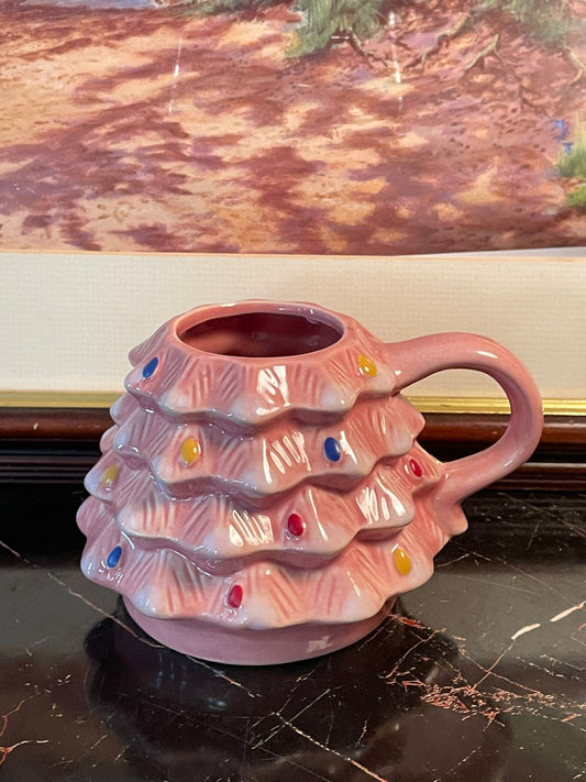 pink christmas tree mug, festive holiday mug Pakistan, ceramic christmas tree cup, collectible holiday mugs, pastel christmas décor, vintage style ceramic mug, christmas hot chocolate mug, rare thrift finds crockery, seasonal ceramic collectibles, festive mugs Pakistan