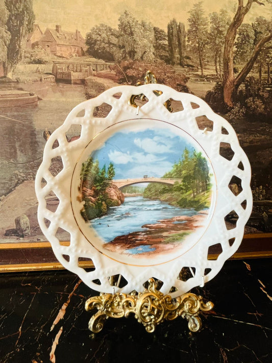 vintage scenic plate, Yellowstone Falls souvenir plate, reticulated porcelain wall plate, landscape collectible plate, vintage travel decor, countryside wall hanging, European porcelain plate, thrifted home decor Pakistan, antique cutwork plate, river bridge vintage collectible
