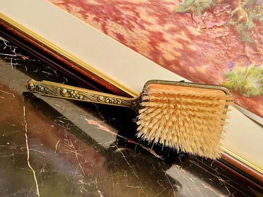 vintage brush, antique vanity brush, brass floral handle brush, embroidered back brush, England vintage collectible, ornate brass hand brush, antique grooming set, vintage decorative brush, Victorian vanity accessory, collectible antique brush, old vanity set Pakistan, vintage brush for decor
