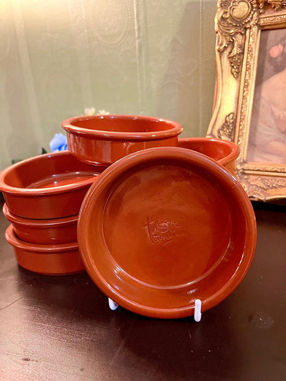 Vintage terracotta bowls set, grouped view showing glazed interior