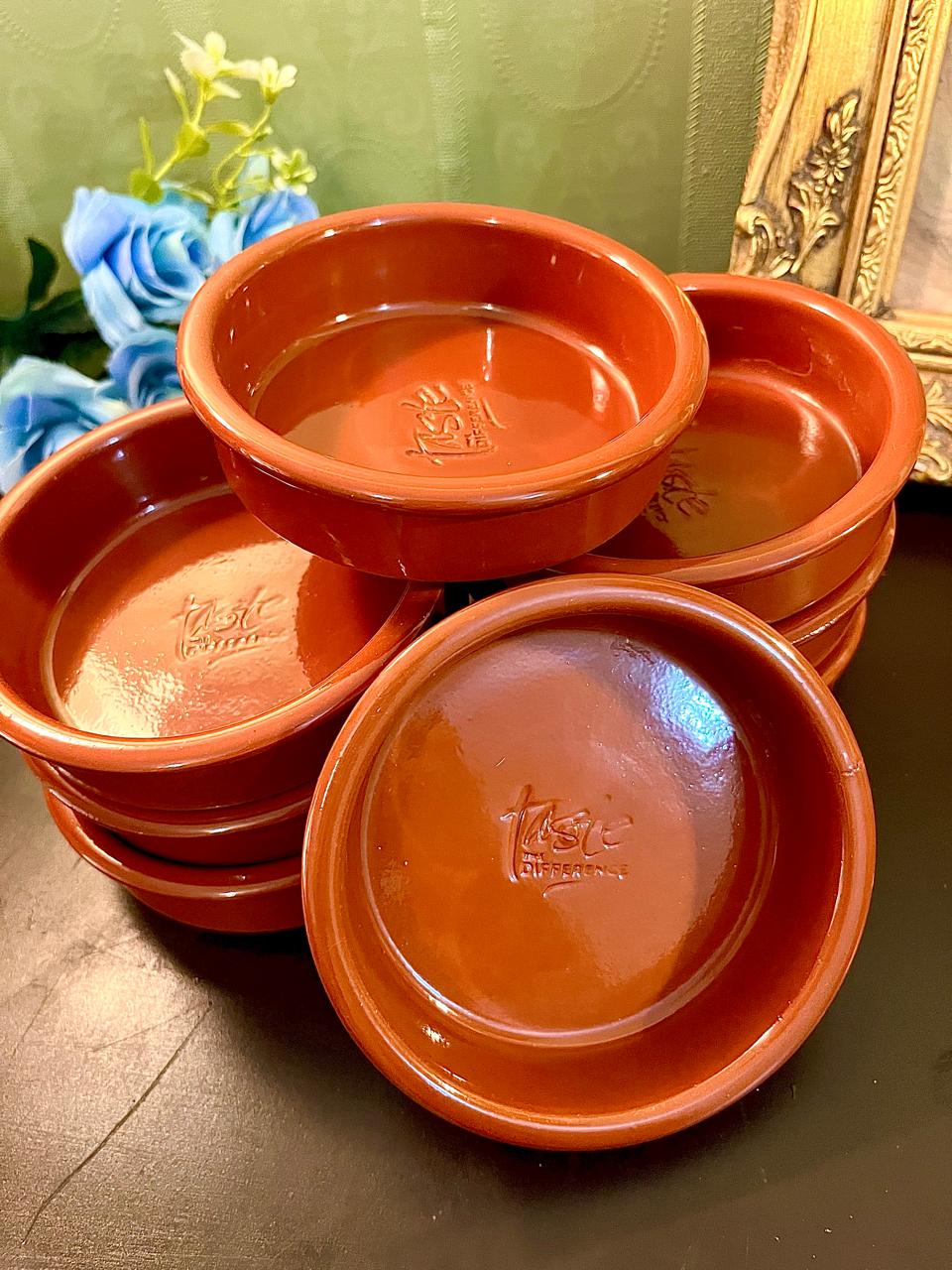 Vintage terracotta bowls stacked, single bowl on top