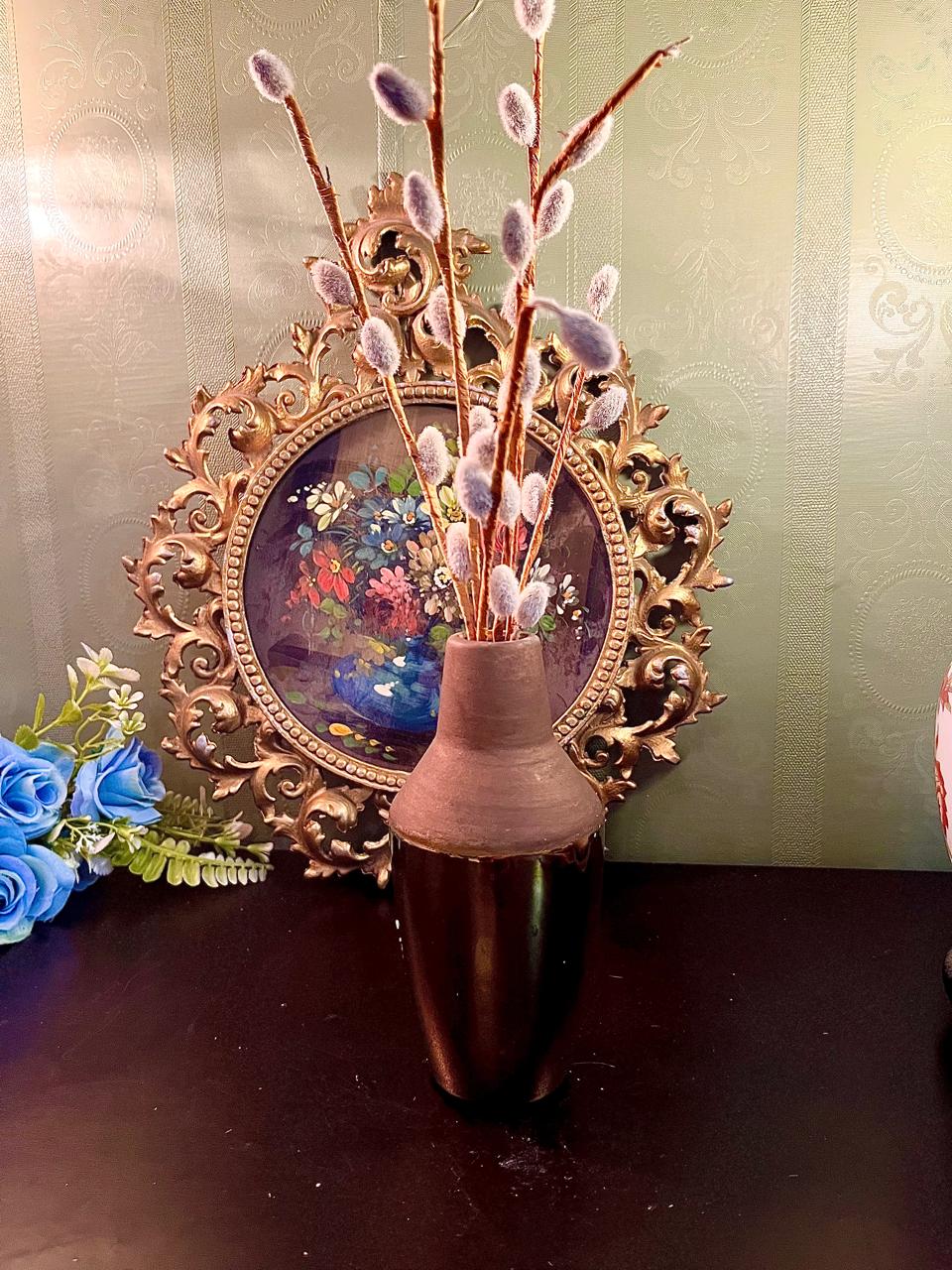 Matte brown and glossy bronze two-tone ceramic vase with pussy willow branches