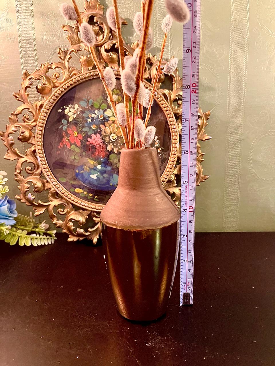 Bronze ceramic vase shown with measuring tape indicating approx. 9 inch height