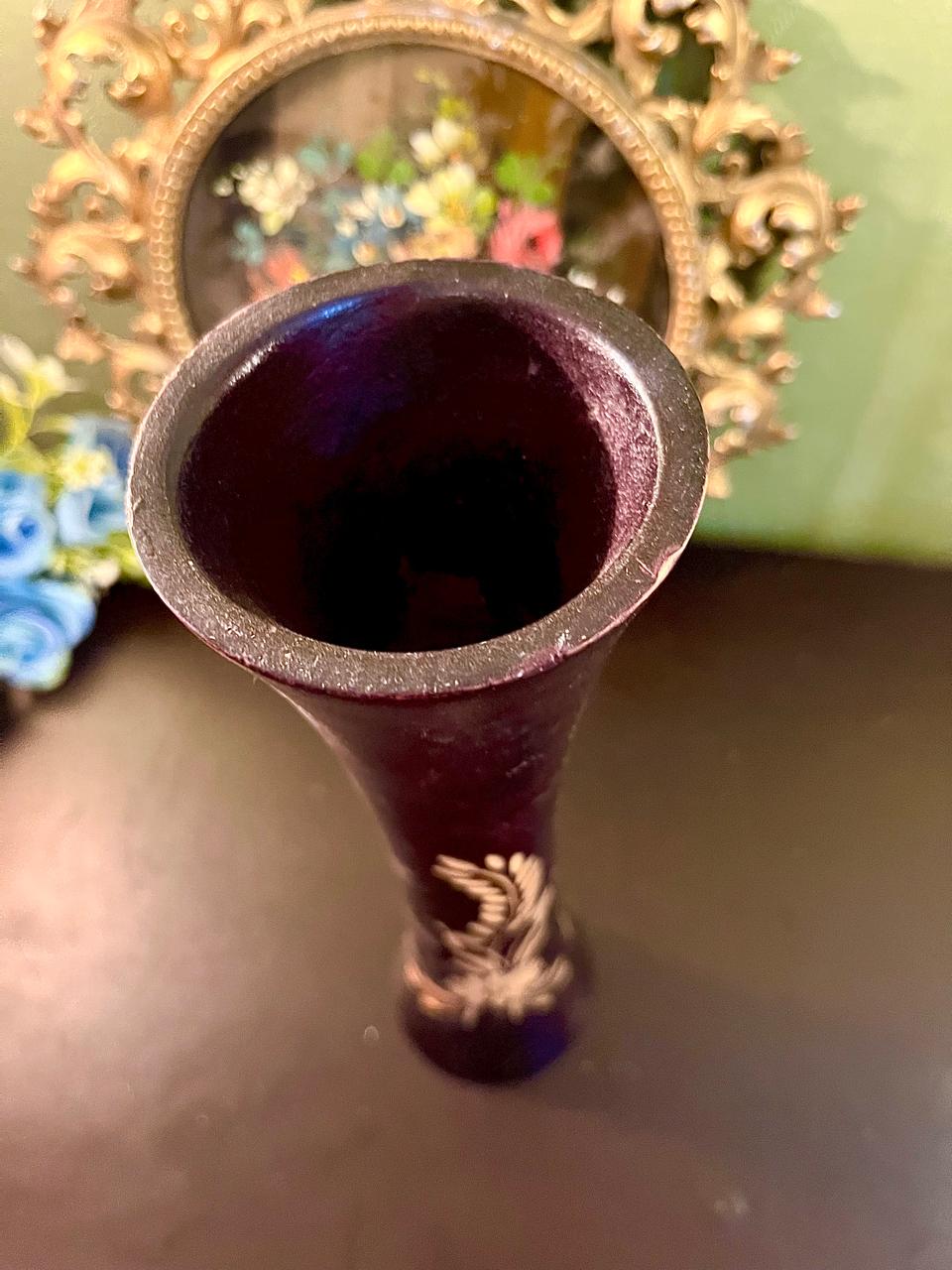 Top-down view of purple glass vase opening