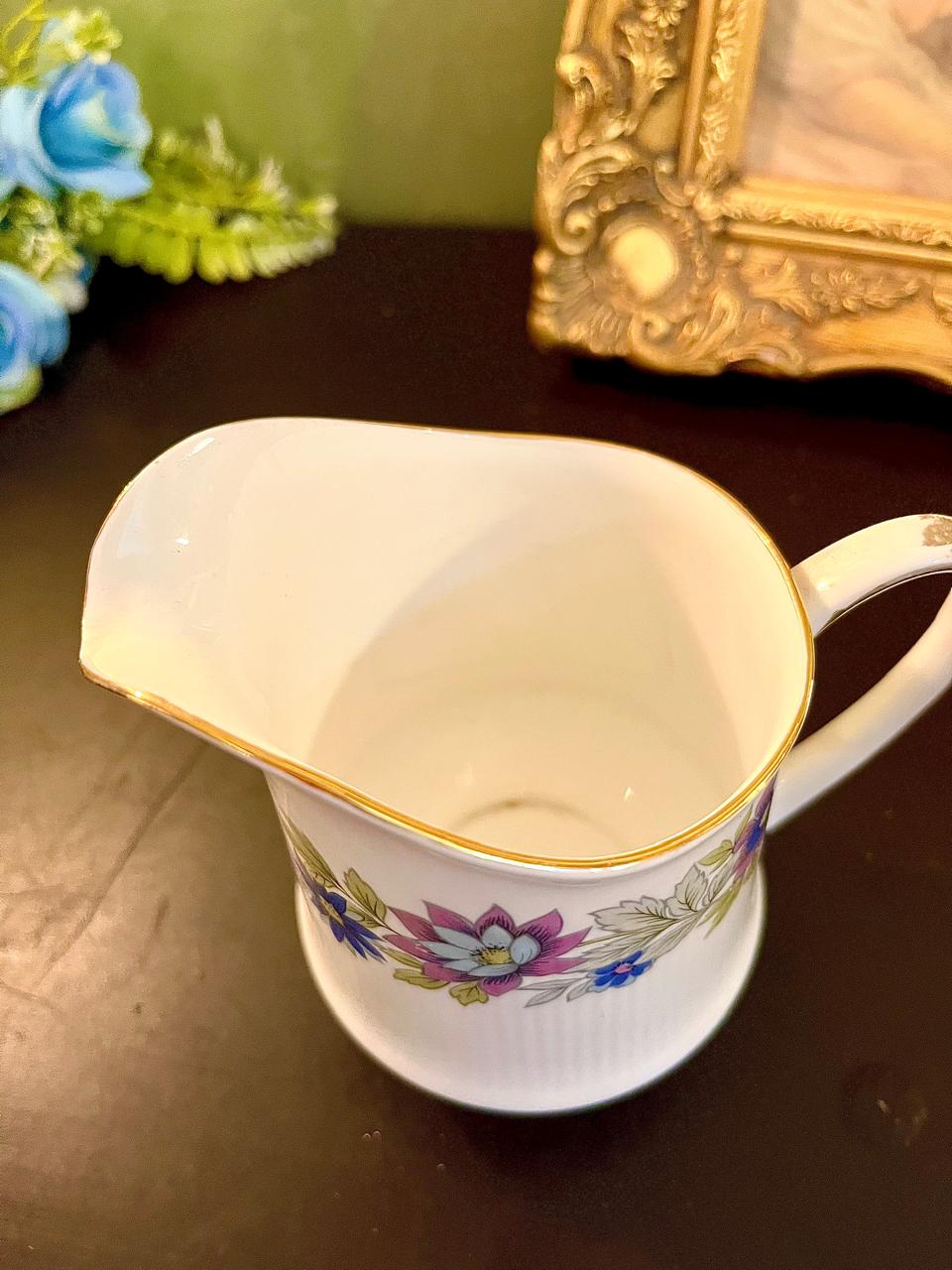 Top-down interior view of vintage floral chintz bone china creamer