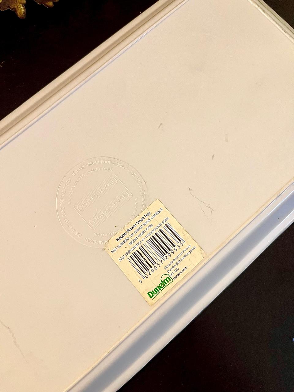 Back of tray showing Dunelm Neutral Flower Small Tray label