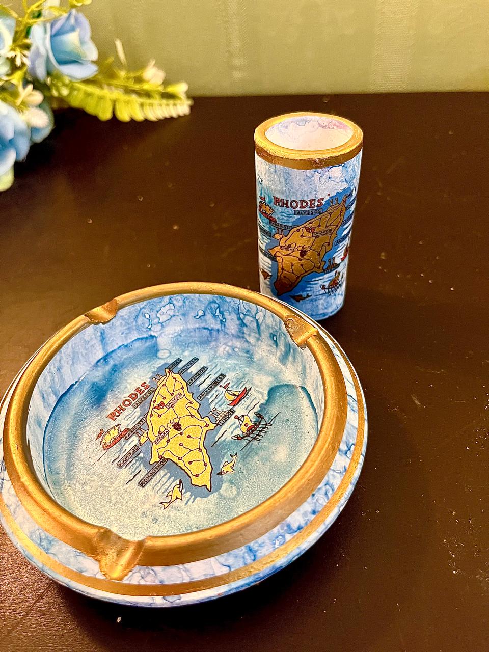 Vintage souvenir ashtray and matching cylinder holder, blue and gold map design