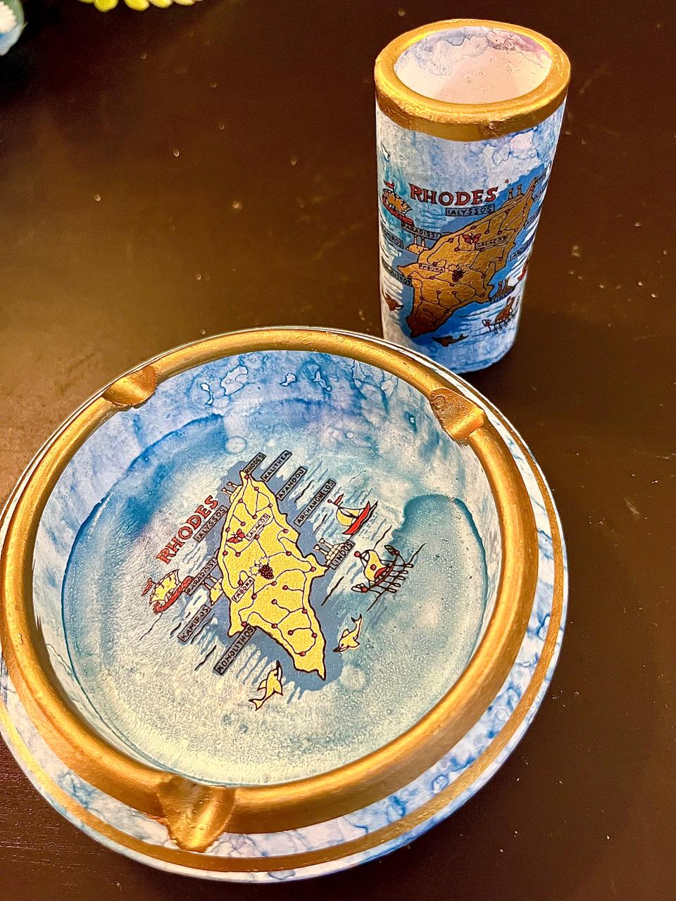 Close-up of vintage souvenir ashtray gold rim and cigarette rests