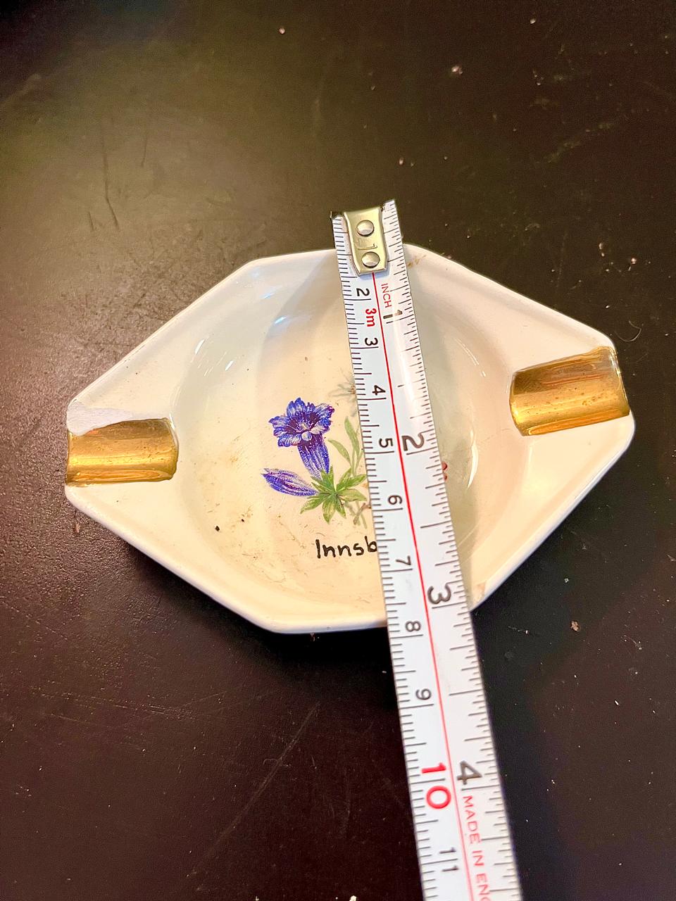 Vintage Innsbruck ashtray with ruler showing approximate 4 inch size