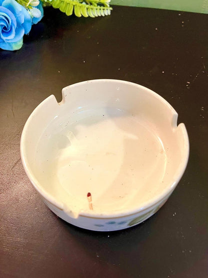 Vintage plain cream ceramic ashtray, side angle