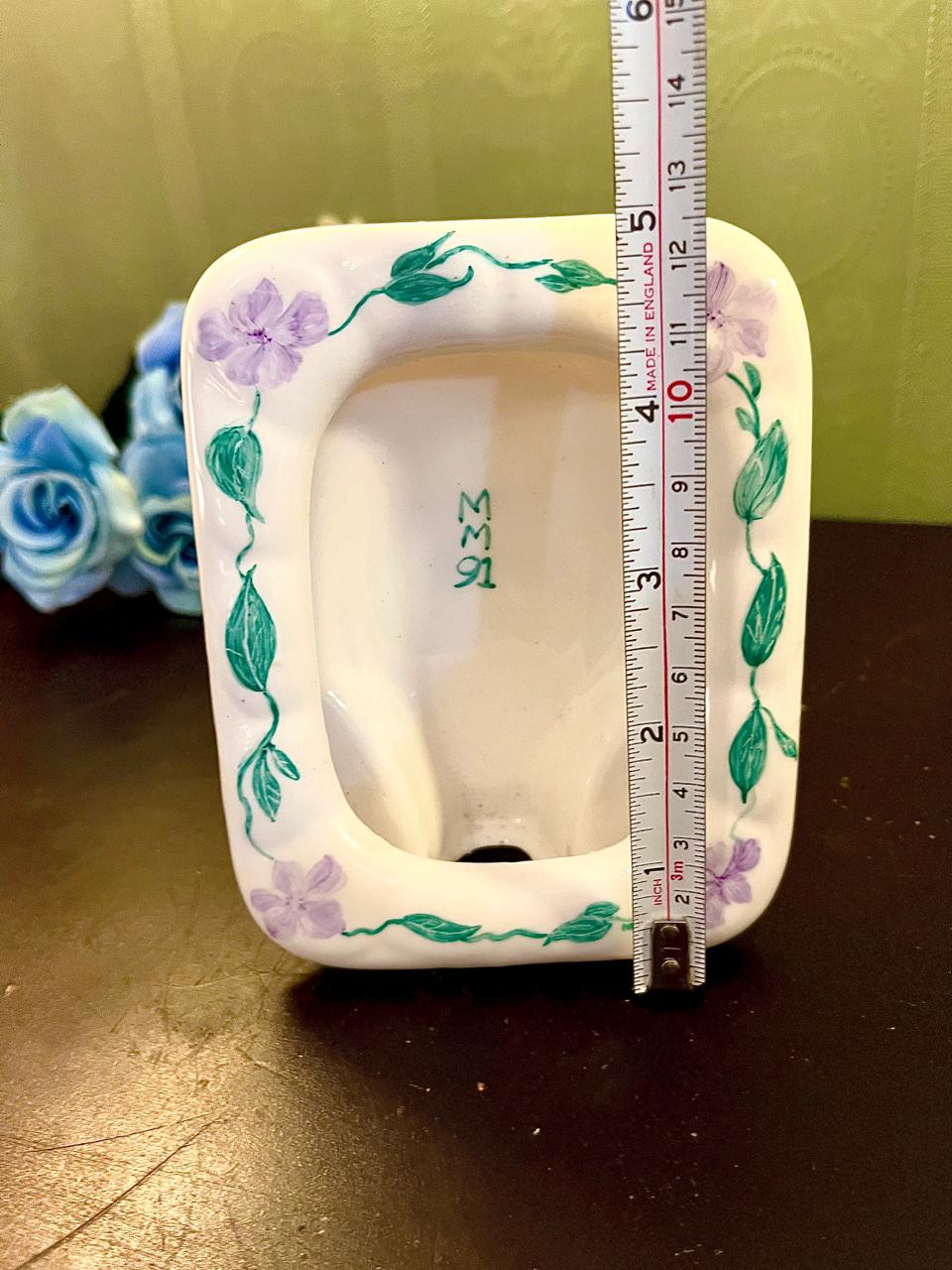 Vintage square ceramic trinket dish, side angle showing scalloped rim and depth
