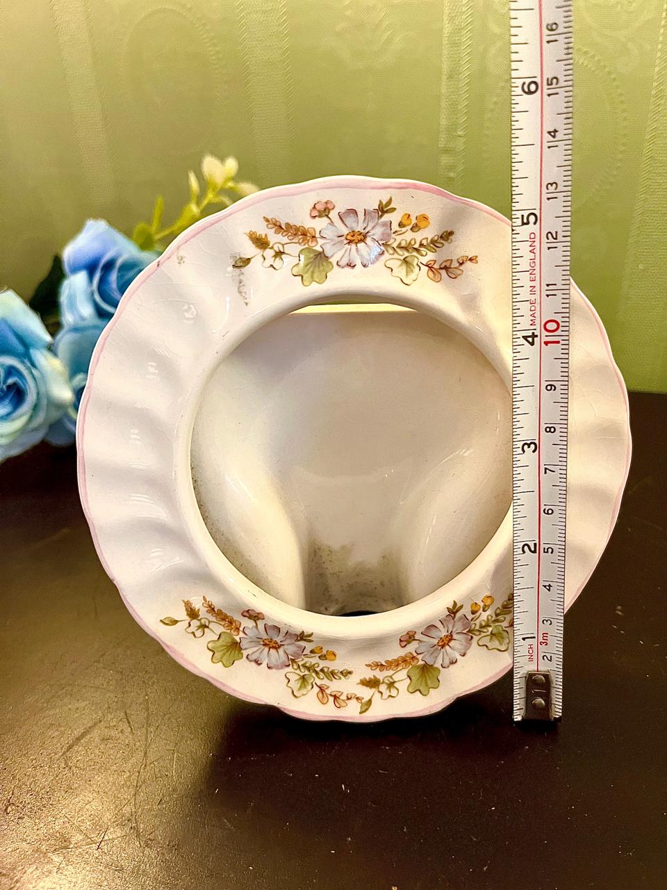 Vintage round ceramic trinket dish with ruler showing approximate 4 inch diameter