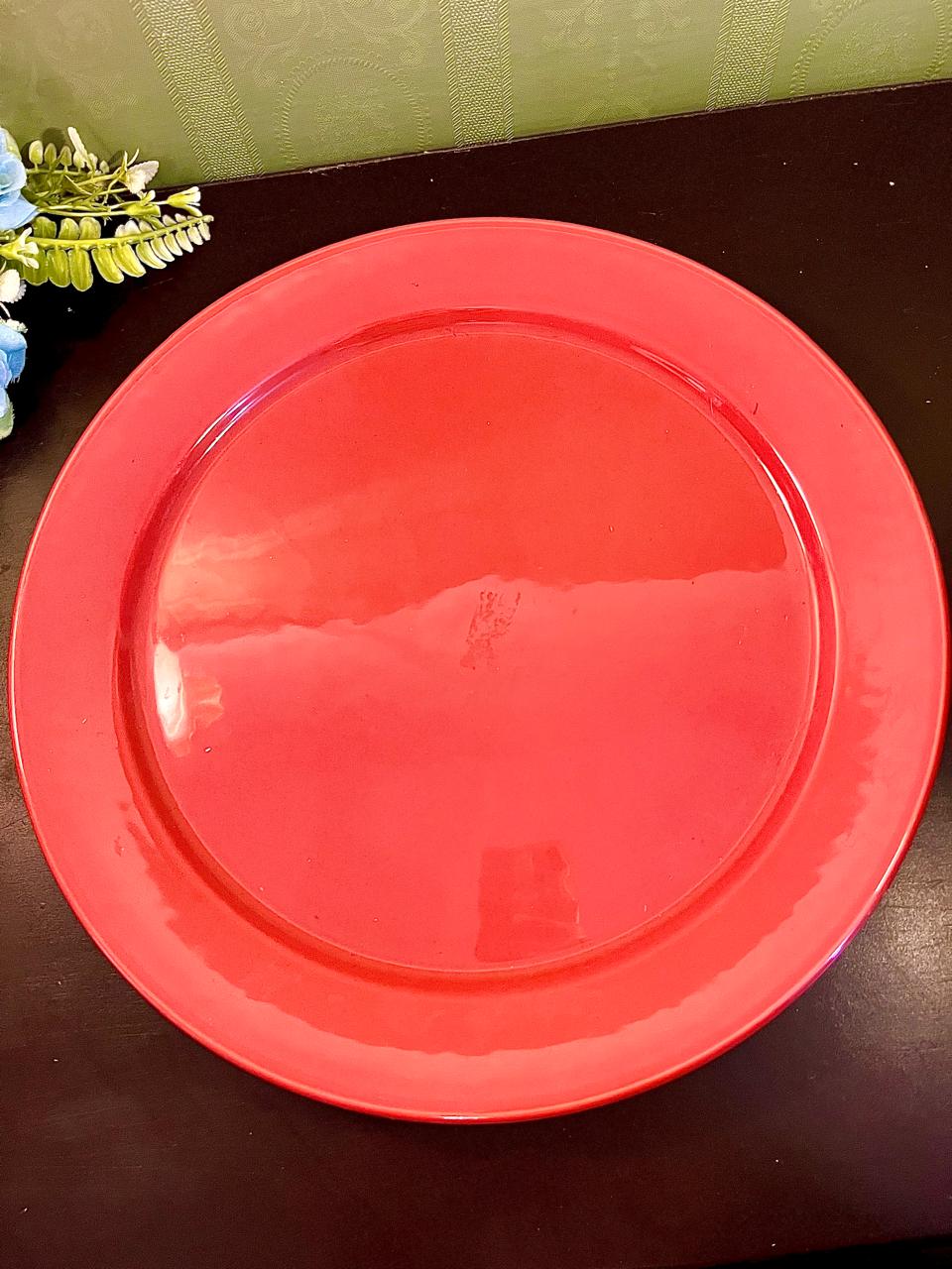 Vintage red ceramic dinner plate, 12 inch, top view showing glossy glaze