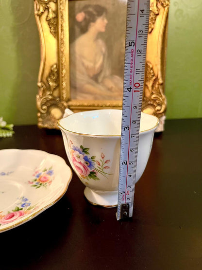 Royal Albert teacup with ruler showing approximately 3 inch height