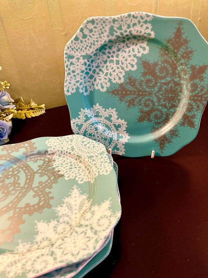 Turquoise square dessert plates with white lace doily print