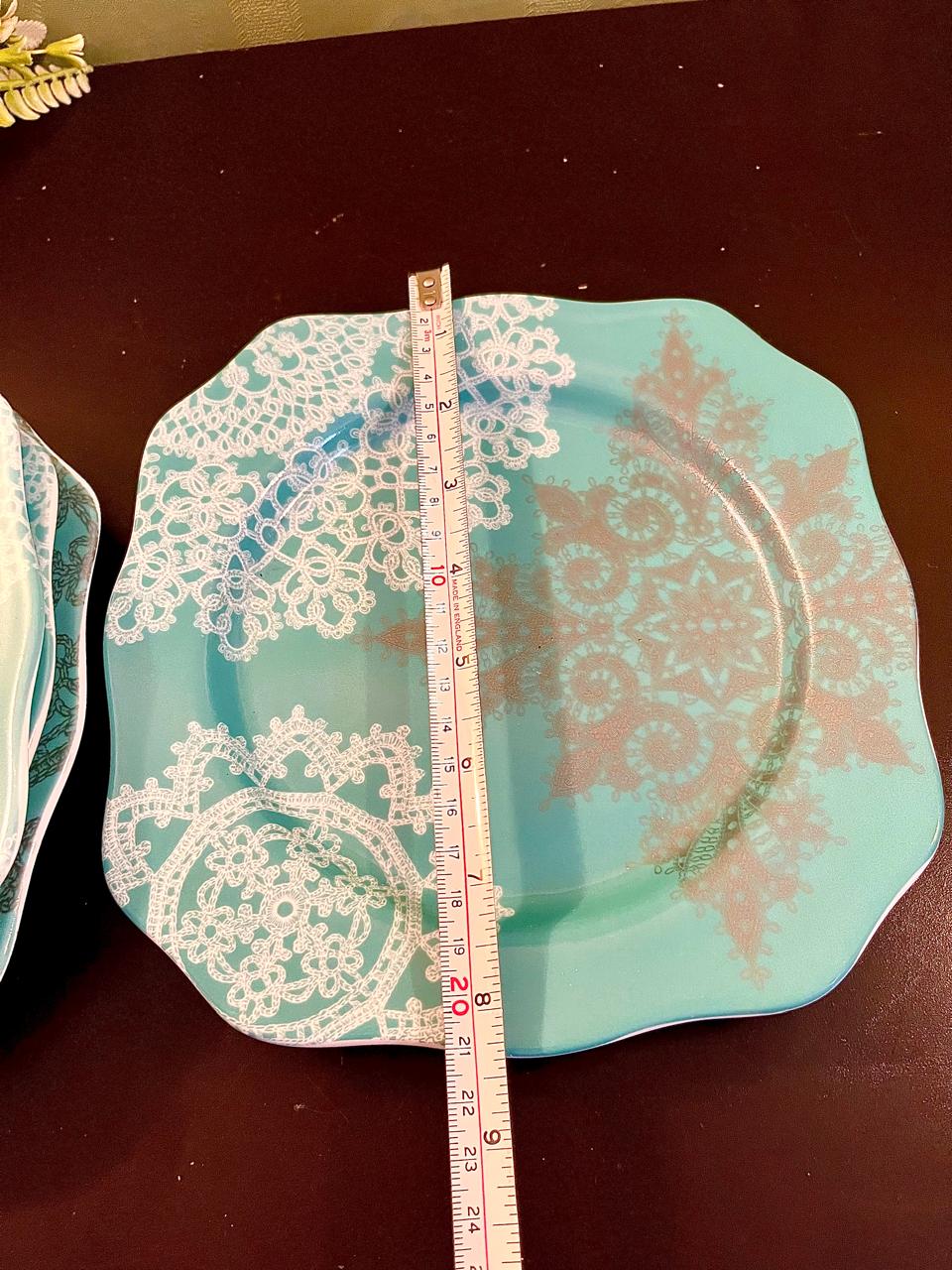 Turquoise lace plate with ruler showing width
