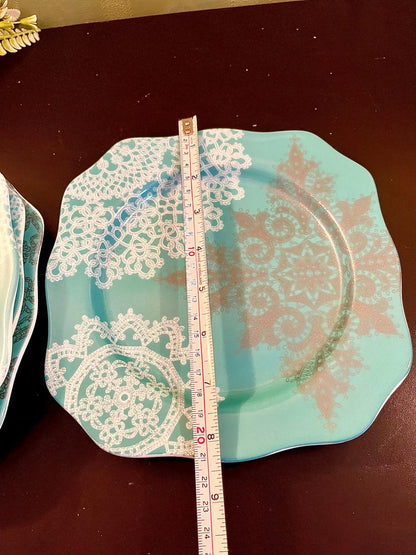 Turquoise lace plate with ruler showing width
